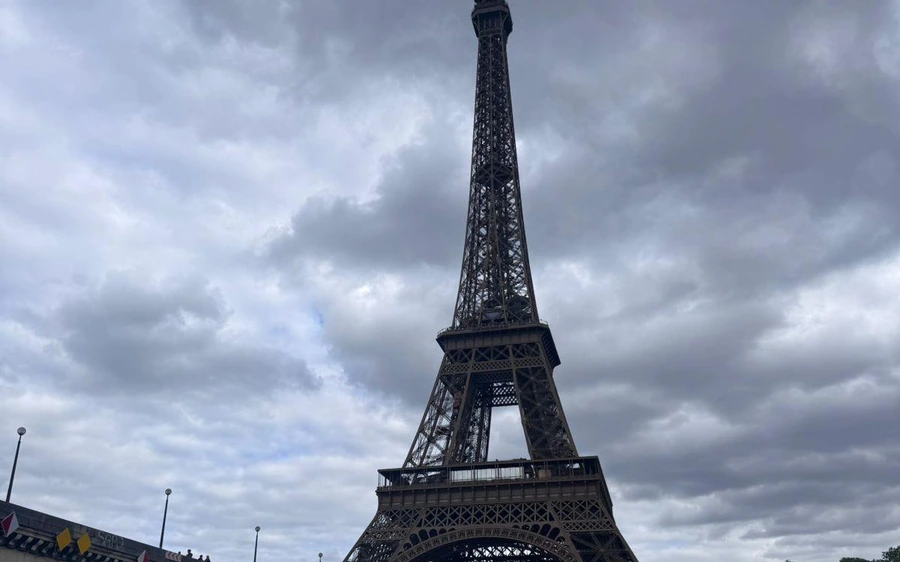 The Eiffel Tower under a cloudy sky
