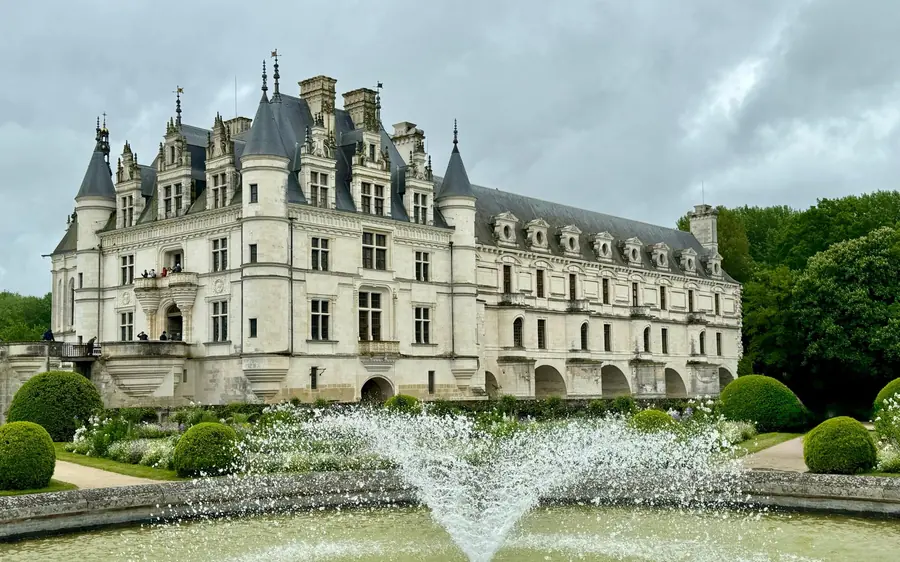A Loire château with turrets reflected in the water below