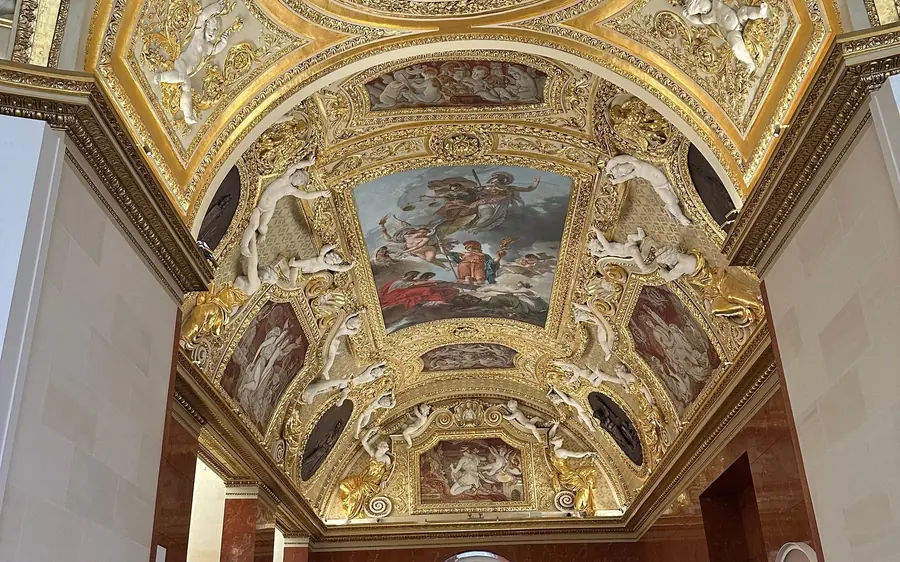 Gilded ceilings and painted panels in a Louvre gallery