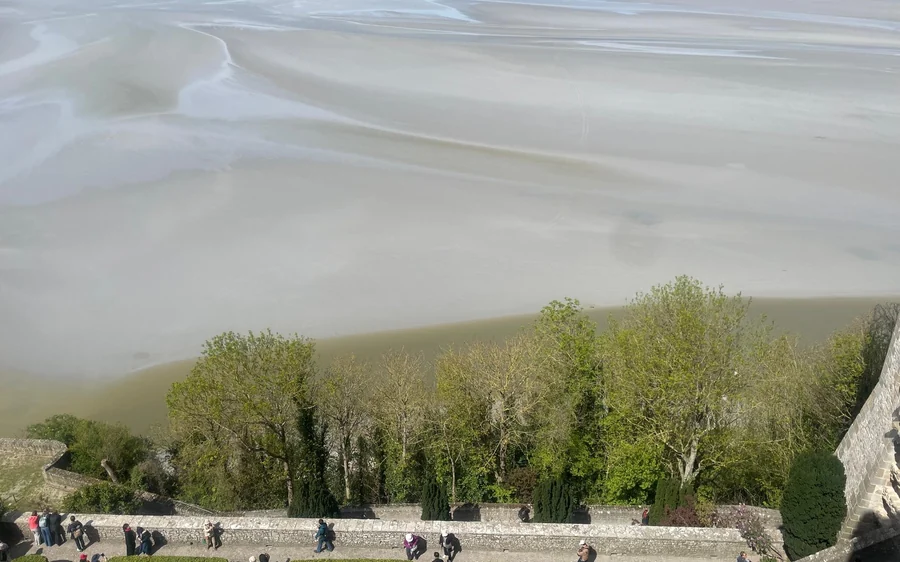 Tidal flats and a wide bay at low tide on the coast