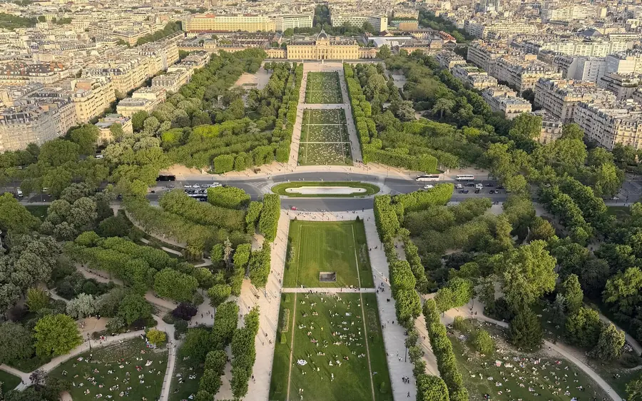 The long lawn of the Champ de Mars seen from the top of the Eiffel Tower
